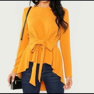 New, never worn, beautiful mustard-colored, asymmetrical top with belt.